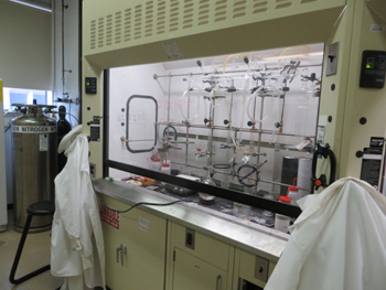 Synthetic chemical fume hoods with custom made Schlenk lines for anhydrous and air-free chemistry.